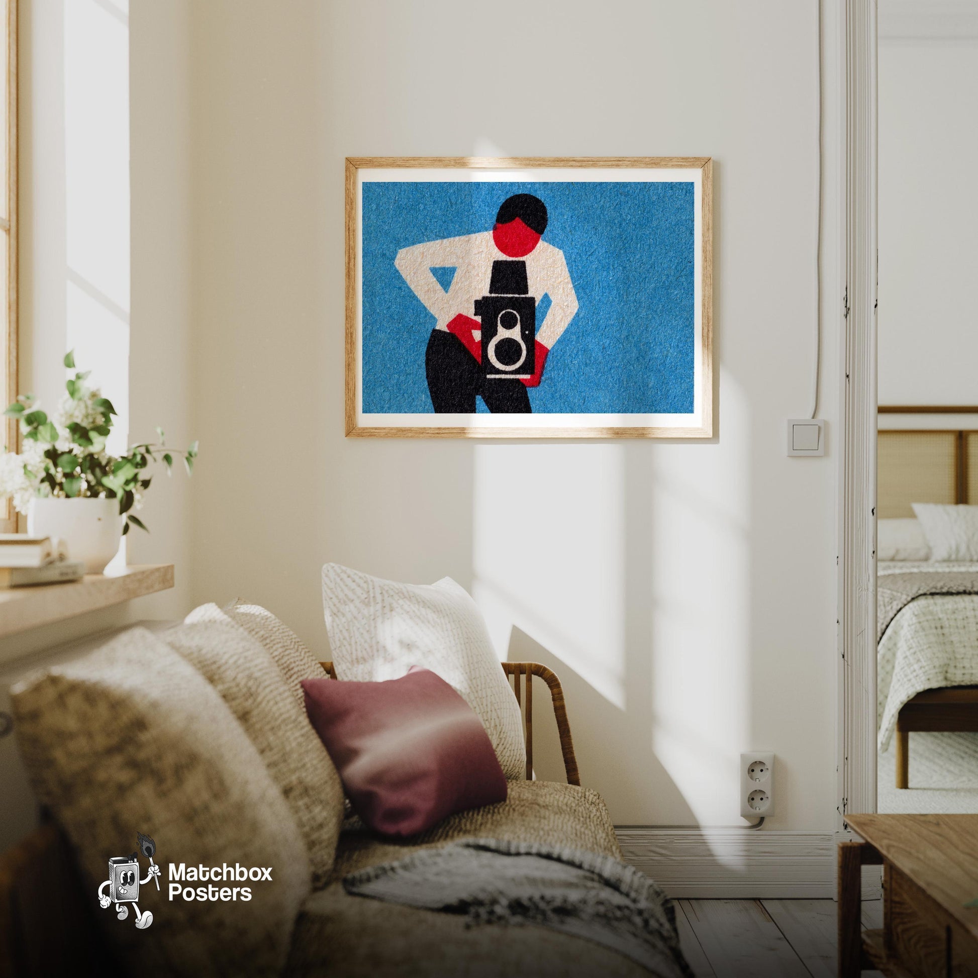 Person Holding A Vintage Camera - vintage matchbox label print - living room mockup
