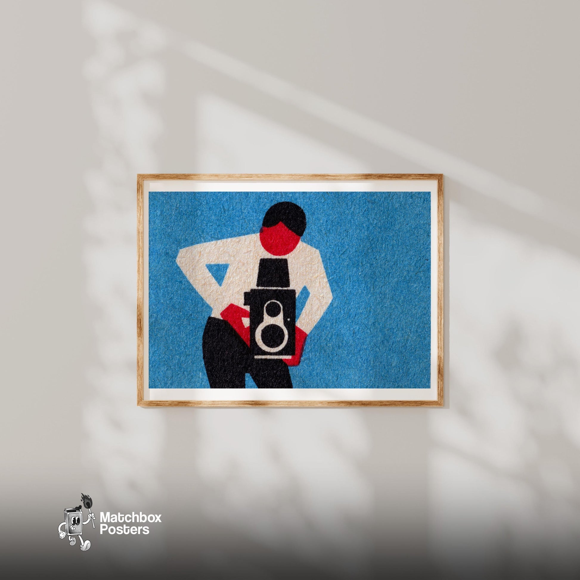 Person Holding A Vintage Camera - vintage matchbox label print - bedroom mockup