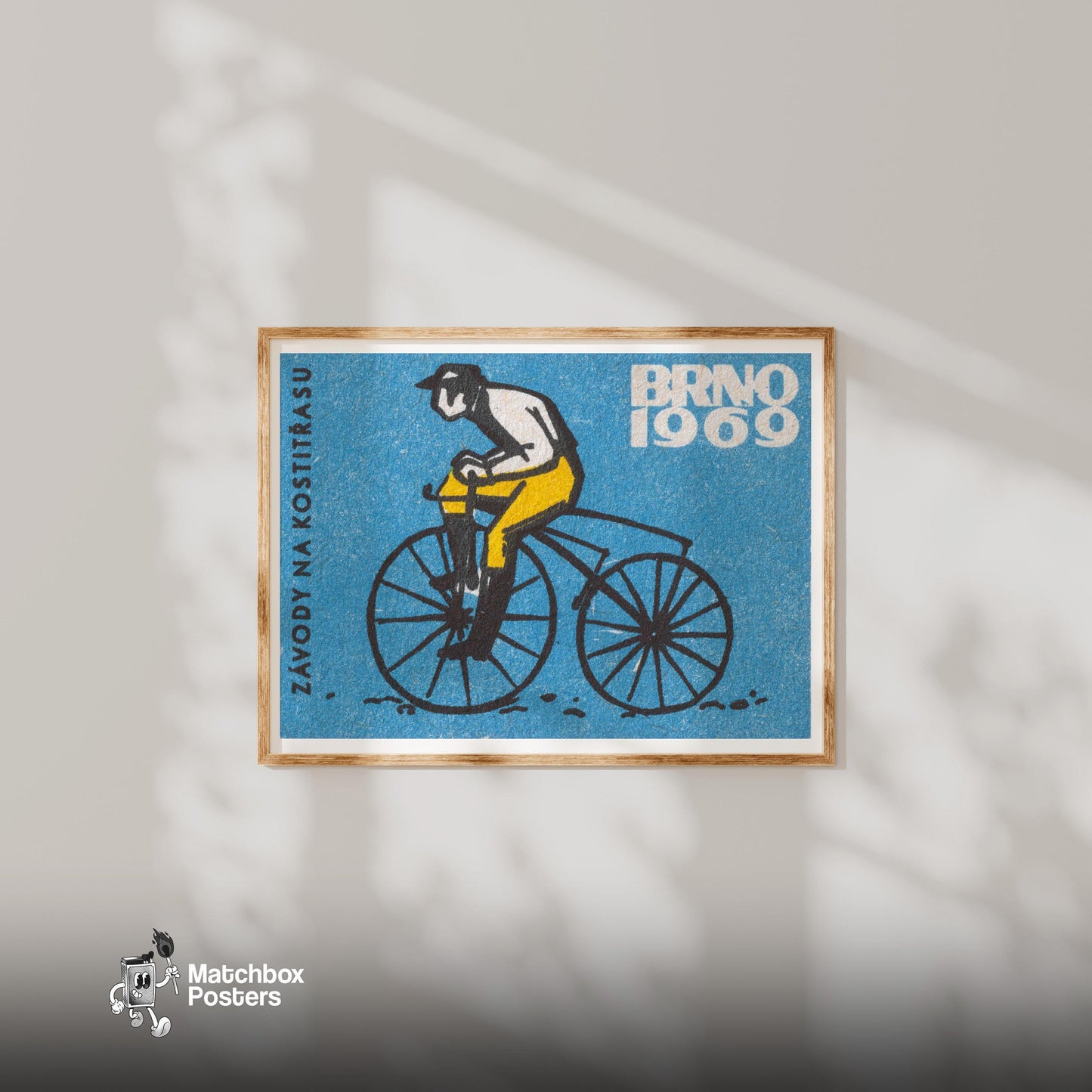 Cyclist on Vintage Bicycle - vintage matchbox label print - living room mockup