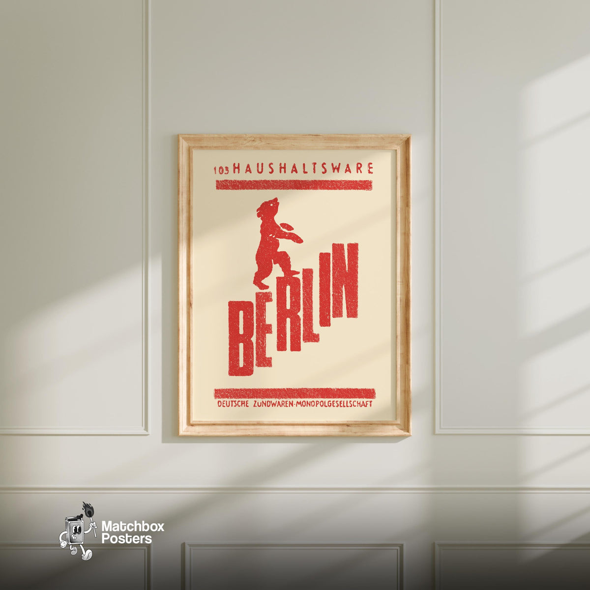 Red bear standing on the word 'BERLIN', a vintage matchbox label from Germany, framed and hanging on a plain wall. Berlin Bear Vintage German Duotone Poster print